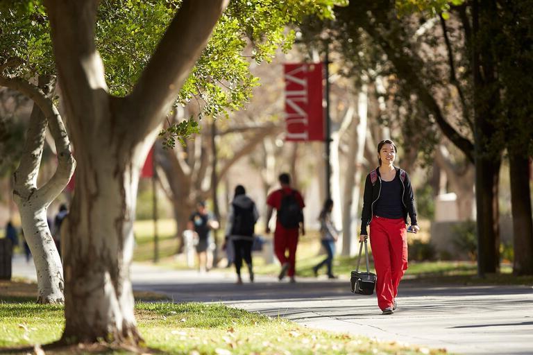 Student walks outside on campus